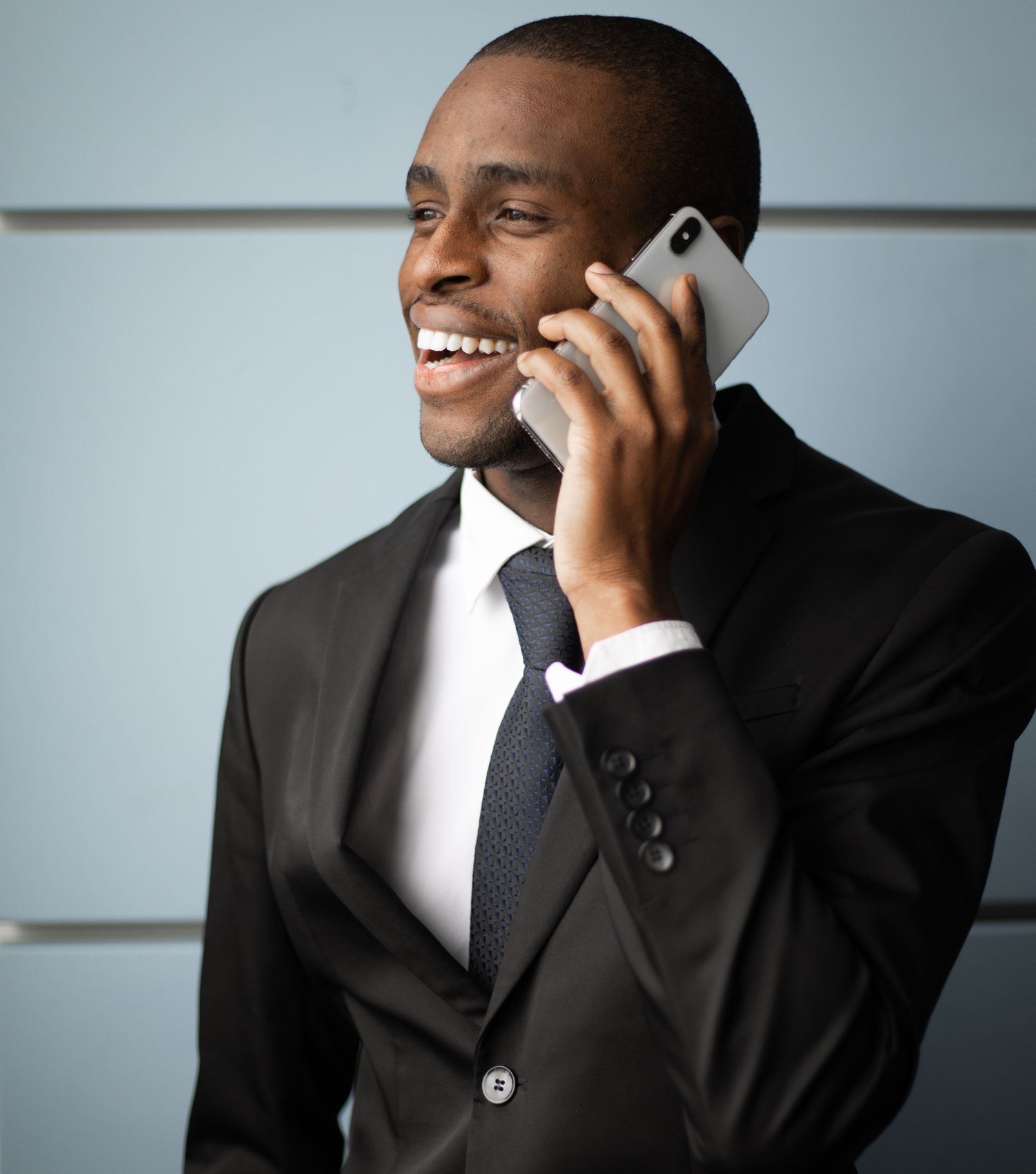 A trader smiling while using the TradersGrid app
